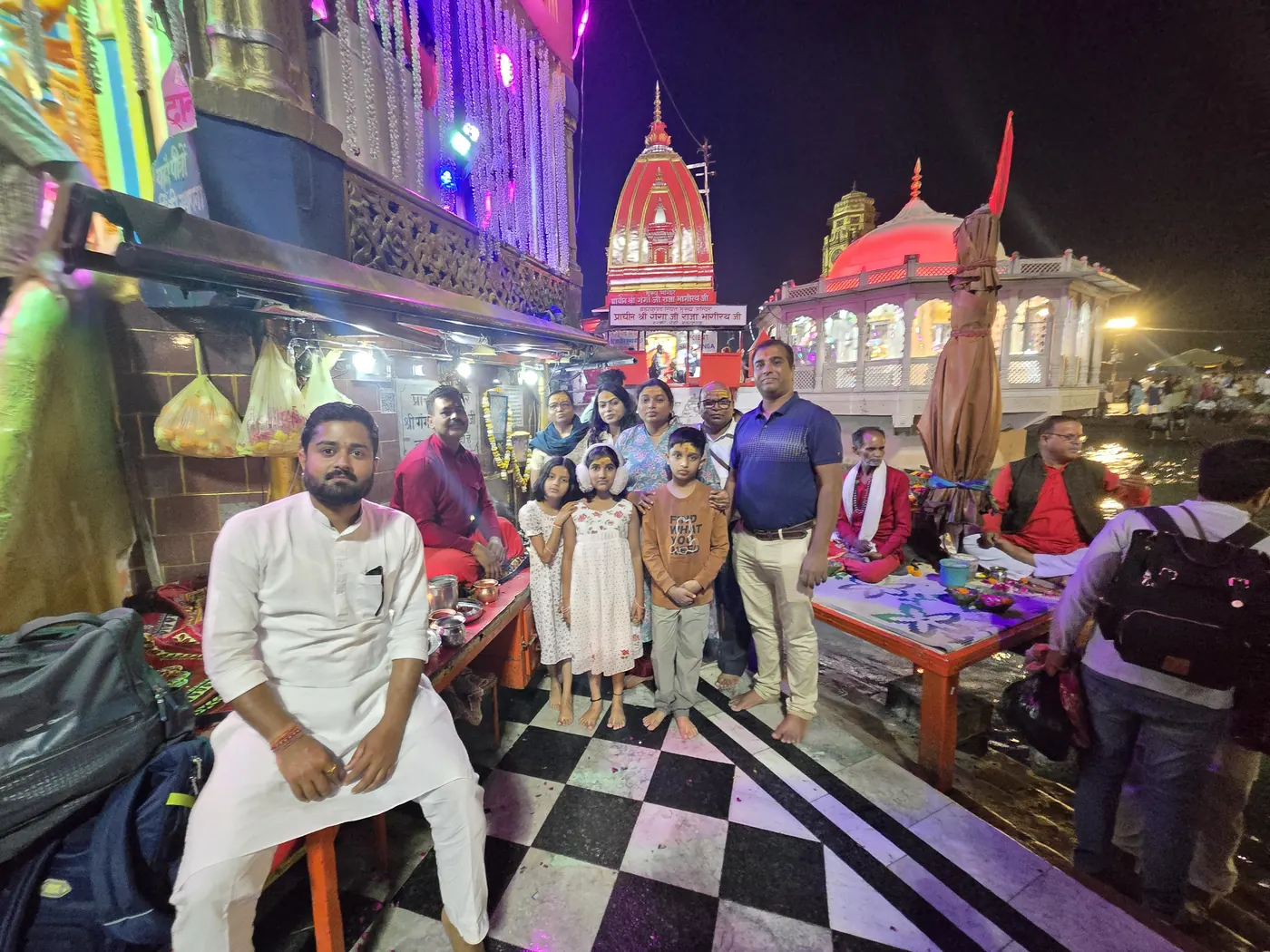 Family with Purohit at Ganga Sabha